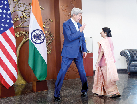 NEW DELHI Indian Minister of External Affairs Sushma Swaraj and US Secretary of State John Kerry arrive prior to a meeting in New Delhi yesterday. — AFP