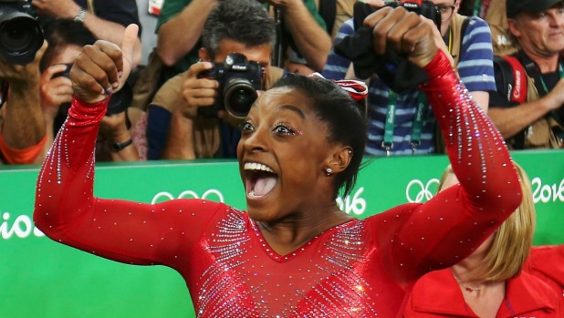 MIKE BLAKE  REUTERS 
 
   Simone Biles reacts with delight after winning the women's vault final to give her three Olympic gold medals so far in Rio