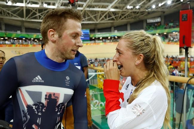 Laura Trott right cries as she congratulates her fiance Jason Kenny left both of Britain after he won the men's keirin cycling final at the Rio Olympic Velodrome during the 2016 Summer Olympics in Rio de Janeiro Brazil Tuesday Aug. 16 2016