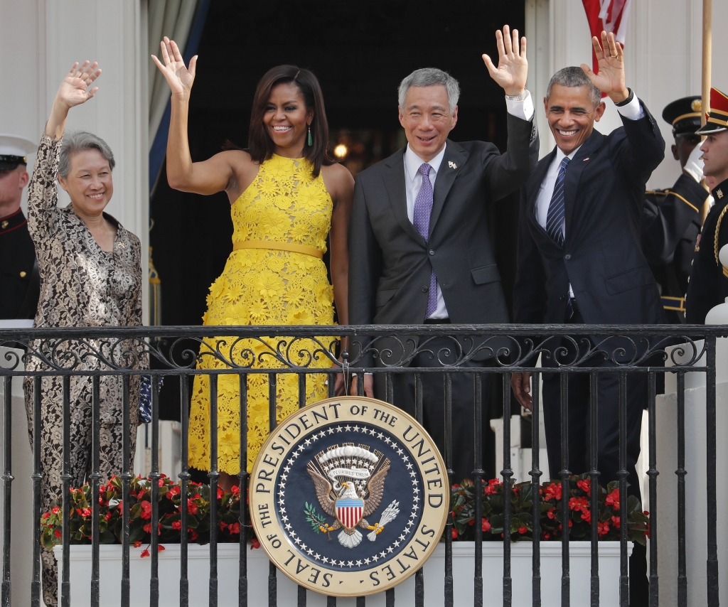 President Obama First Lady Michelle Obama Singapore's Prime Minister Lee Hsien Loong and his wife Ho Ching wave from the Truman Balcony of the White House