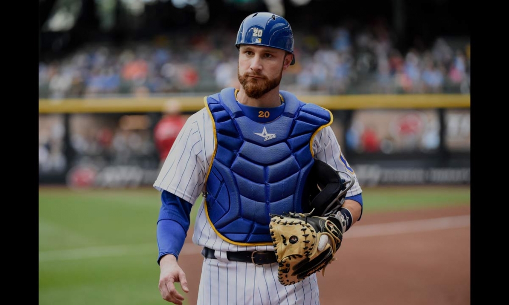 Milwaukee Brewers catcher Jonathan Lucroy gets ready before a baseball game against the Pittsburgh Pirates in Milwaukee