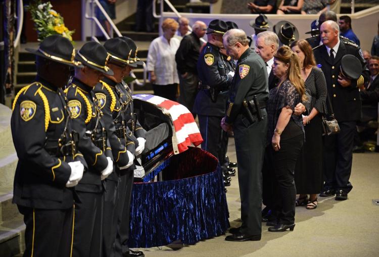 Mourners view the body of East Baton Rouge Sheriff deputy Brad Garafola at the Istrouma Baptist Church Saturday