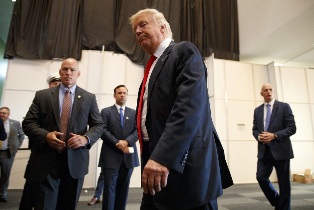 Republican presidential candidate Donald Trump walks away after speaking to reporters before a town hall event Monday Aug. 1 2016 in Columbus Ohio