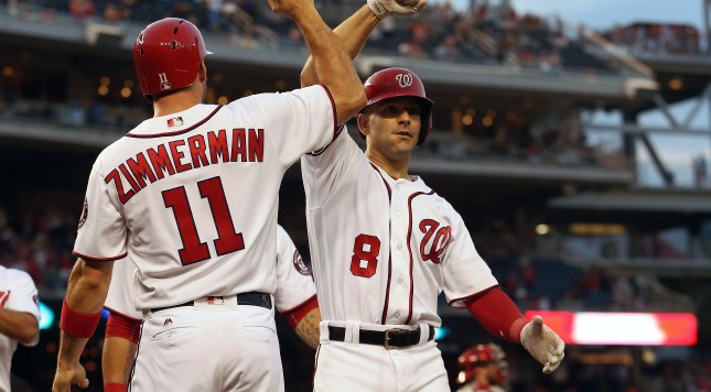 WASHINGTON DC- JUNE 30 Danny Espinosa #8 of the Washington Nationals celebrates with teammate Ryan Zimmerman #11 after hitting a grand slam home run in the third inning against the Cincinnati Reds at Nationals Park