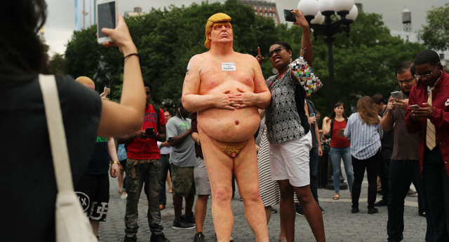 Onlookers took selfies and poked fun at the naked Trump