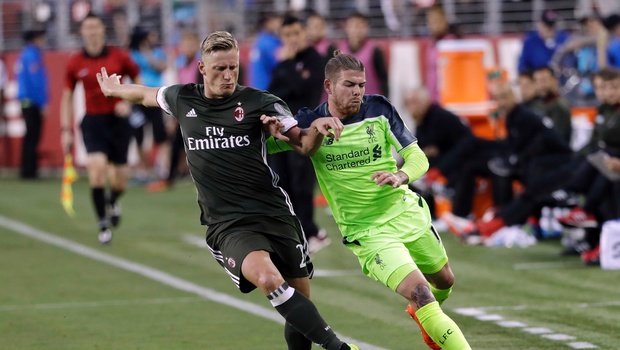 AC Milan's Ignazio Abate left works for possession next to Liverpool's Alberto Moreno during the second half of an International Champions Cup soccer match Saturday