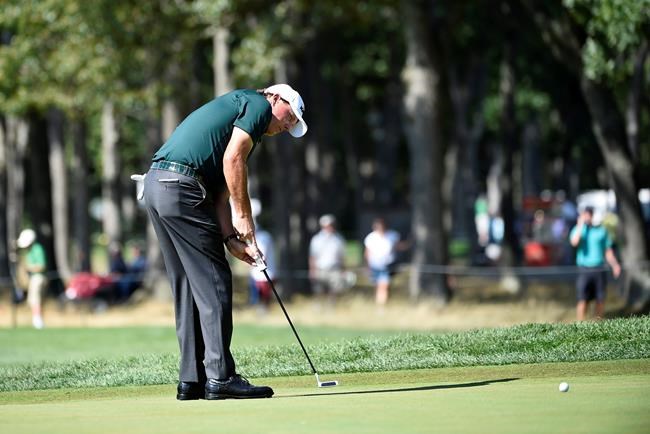 Phil Mickelson putts on the seventh green during the third round of the Barclays golf tournament in Farmingdale N.Y. Saturday Aug. 27 2016