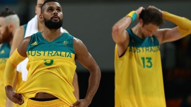 Patty Mills and David Andersen show their disappointment