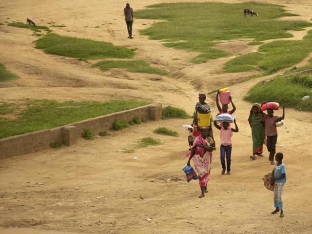 People walk with their belongings in the capital Juba South Sudan