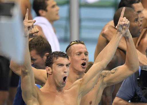 United States Michael Phelps celebrates as his team wins the gold medal in the men's 4x100-meter freestyle final during the swimming competitions at the 2016 Summer Olympics Sunday Aug. 7 2016 in Rio de Janeiro Brazil