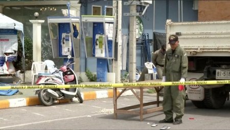 Police Explosive Ordnance Disposal official inspects the site of a bomb blast in Hua Hin south of Bangkok Thailand in this still image taken from video