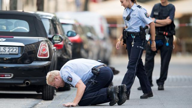 Police search for traces at the location of an incident in Cologne Germany after a man was seriously wounded in an early-morning scuffle