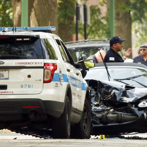 Chicago police investigate a police involved fatal shooting in Chicago's South Shore neighborhood. Police say they shot and killed an 18-year-old man who was in a stolen Jaguar that sideswiped a squad