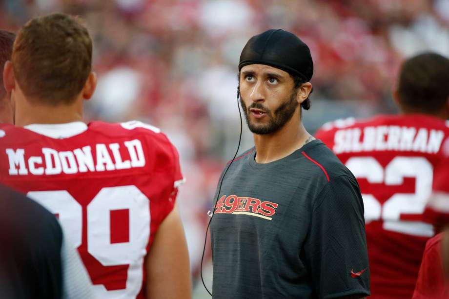 San Francisco 49ers quarterback Colin Kaepernick stands on the sidelines during the second half of an NFL preseason football game against the Houston Texans Sunday Aug. 14 2016 in Santa Clara Calif