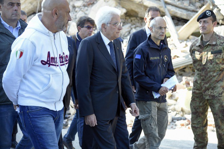 Italy's President Sergio Mattarella walks past an Italian soldiers as he visits with mayor of Amatrice Sergio Pirozzi the damaged central Italian village of Amatrice