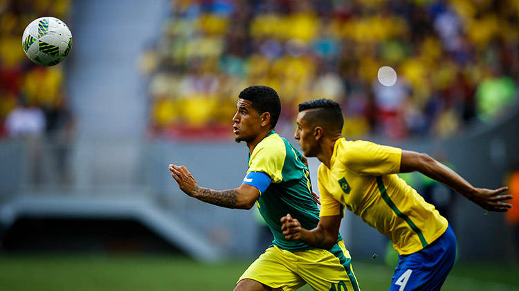 Keagan Dolly of South Africa in action against Marquinhos of Brazil during the men's first round match between Brazil and South Africa for the Rio 2016 Olympic Games Soccer tournament at Mane Garrincha stadium in Brasilia Brazil 04 August 2016