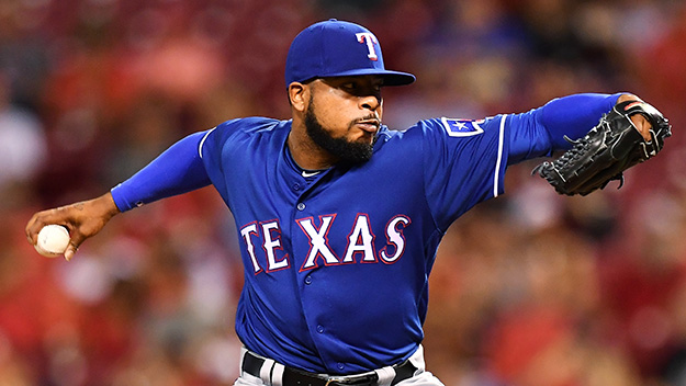 Jeremy Jeffress of the Texas Rangers pitches in the seventh inning against the Cincinnati Reds at Great American Ball Park