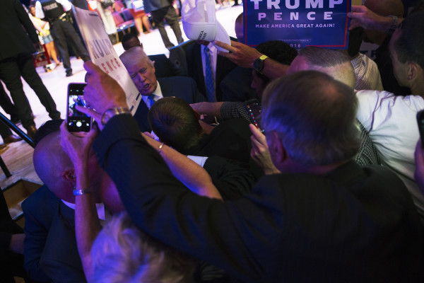 Republican presidential nominee Donald Trump signs autographs at the end of his August rally in Portland