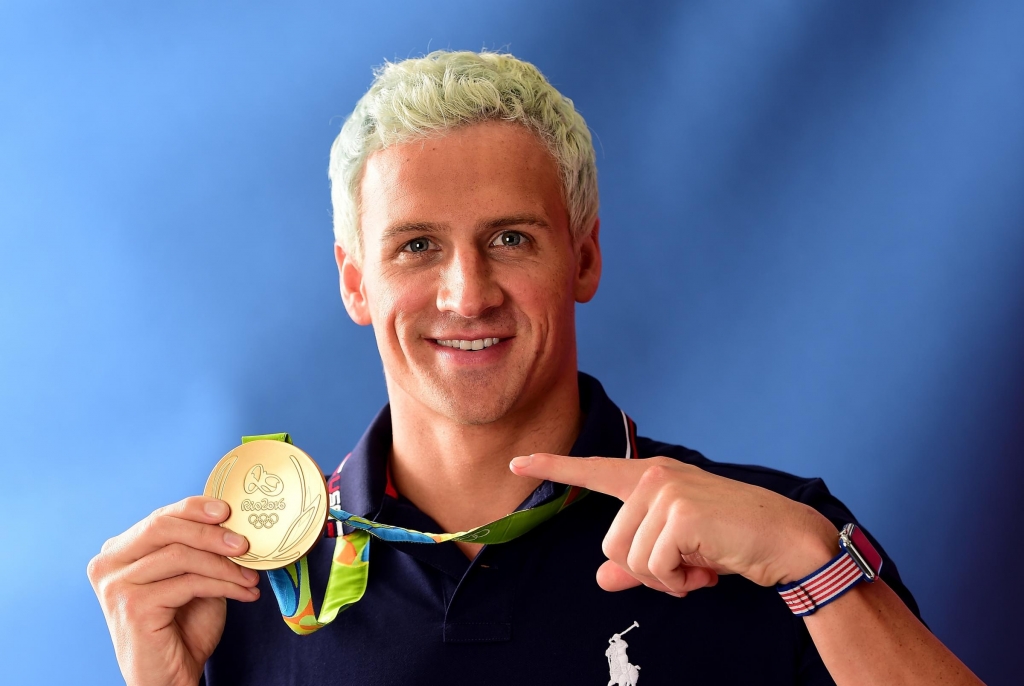 Ryan Lochte poses with his gold medal on the Today show set on Copacabana Beach on last week