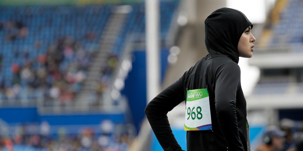 Saudi Arabia's Kariman Abuljadayel after competing in a women's 100-metre heat during the athletics competitions of the 2016 Summer Olympics