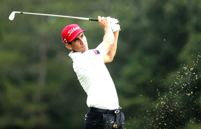 Rafa Cabrera Bello hits a tee shot on the 16th hole during the first round of the Wyndham Championship at Sedgefield Country Club in Greensboro North Carolina Thursday. — AFP