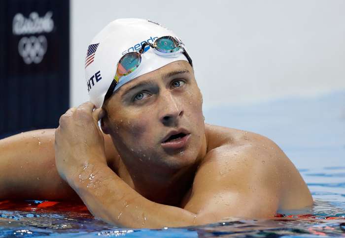 United States&#039 Ryan Lochte checks his time in a men's 4x200-meter freestyle heat during the swimming competitions at the 2016 Summer Olympics in Rio de Janeiro Brazil. AP