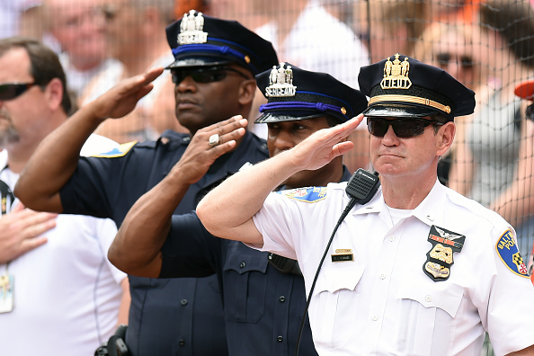 BALTIMORE MD- JULY 10 Baltimore policeman during the National Anthem before a baseball game between the Baltimore Orioles and the Los Angeles Angels of Anaheim at Oriole Park at Camden Yards