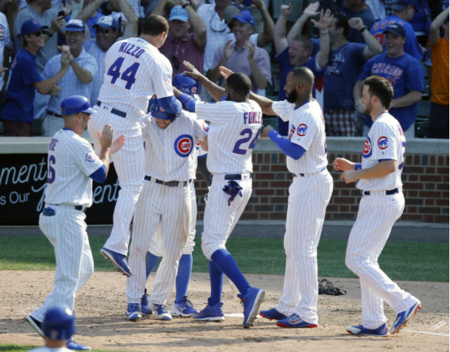 The Cubs celebrate Wednesday's ninth-inning comeback win- their second walk-off win in four days