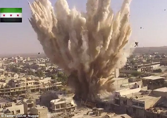 The footage shows a huge explosion tearing through a building in the Syrian city of Aleppo