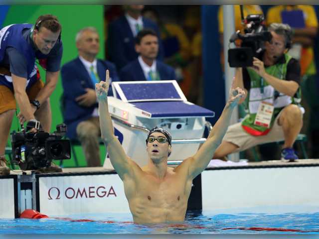 United States&#39 Michael Phelps celebrates winning the gold medal in the men's 200-meter butterfly during the swimming competitions at the 2016 Summer Olympics Tuesday in Rio de Janeiro Brazil. Associated Press