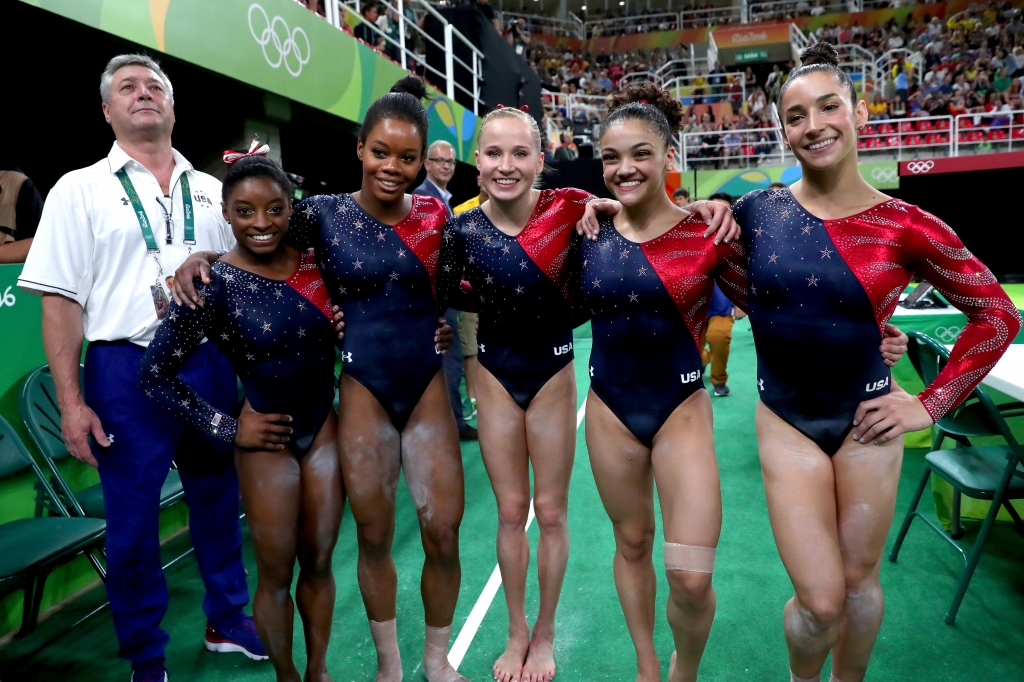 Coach Mihai Brestyan Simone Biles Gabrielle Douglas Madison Kocian Lauren Hernandez and Alexandra Raisman of the United States pose for