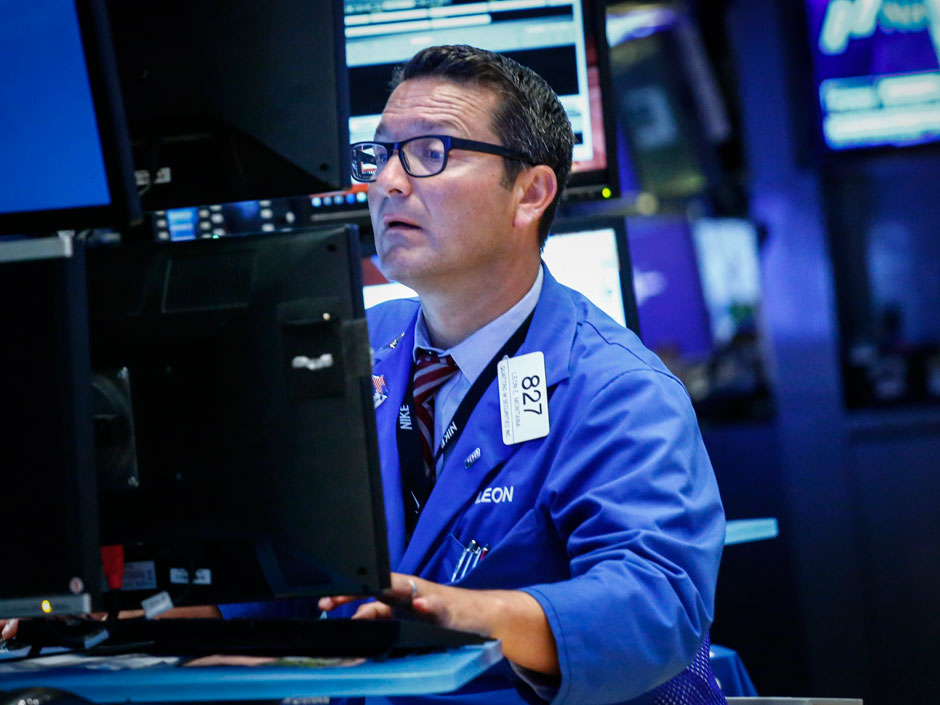 A trader works on the floor of the New York Stock Exchange