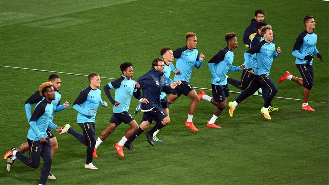 Tottenham Hotspur players run during a football training session at AAMI Park in Melbourne