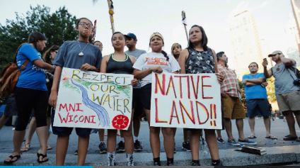 Tribe members protesting the for-profit Bakken oil pipeline