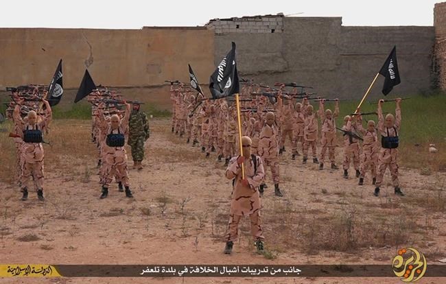 25 2015 by a militant website which has been verified and is consistent with other AP reporting young boys known as the'lion cubs hold rifles and Islamic State group flags as they exercise at a training