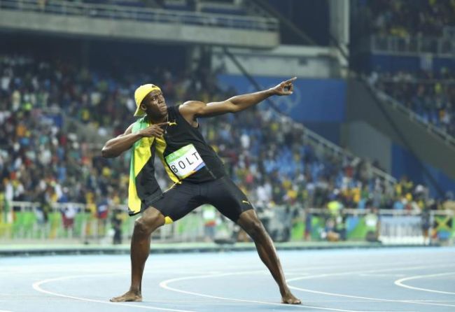 2016 Rio Olympics- Athletics- Final- Men's 100m Final- Olympic Stadium- Rio de Janeiro Brazil- 14/08/2016. Usain Bolt of Jamaica celebrates winning the gold. REUTERS  Lucy Nicholson