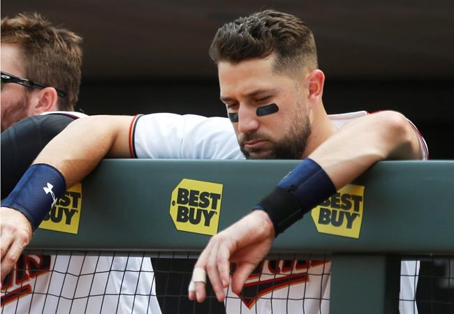 Minnesota Twins&#39 Trevor Plouffe leans on the dugout rail in the waning moments of the Twins 8-5 loss to the Detroit Tigers in a baseball game Thursday Aug. 25 2016 in Minneapolis. The Tigers won 8-5 sweeping the three-game series and handing the T