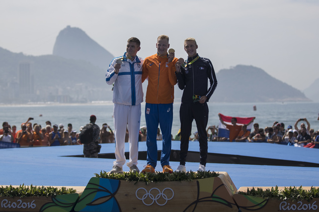 Gold medalist Ferry Weertman of the Netherlands center is joined on the podium by silver medalist Spyridon Gianniotis of Greece left and bronze medalis