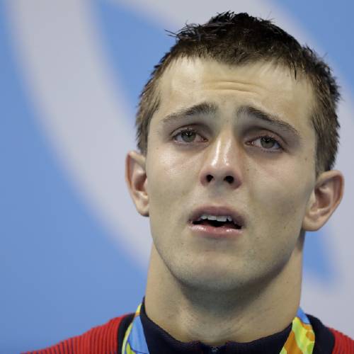 Swimmer Ryan Held breaks down in tears after winning gold medal in the 4x100m relay