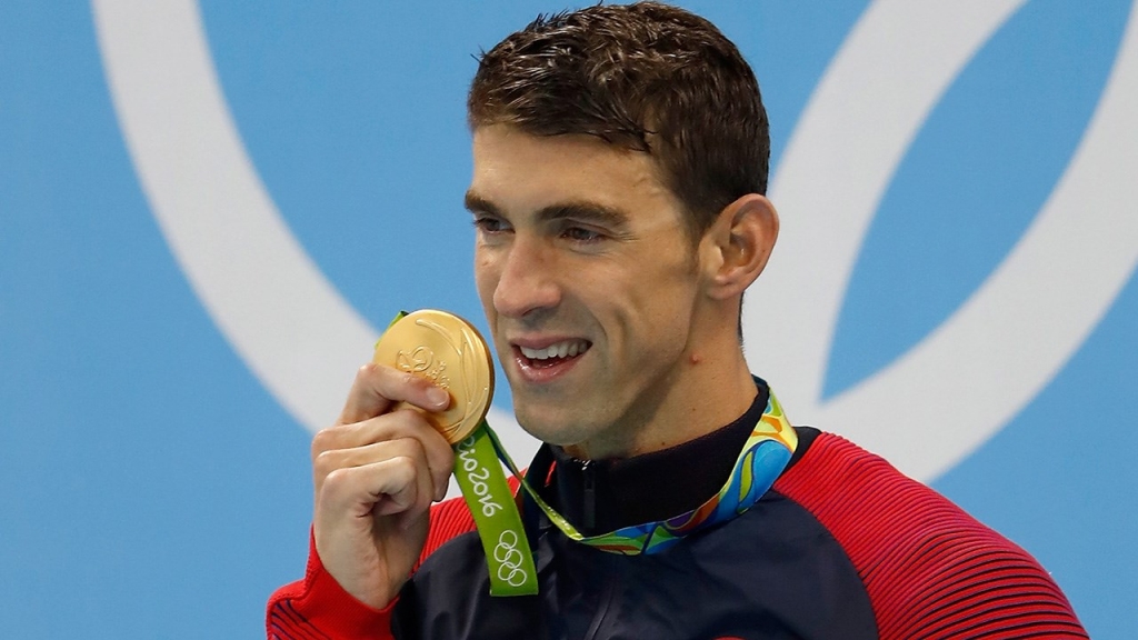 Michael Phelps' Son Boomer Steals the Show Again As Phelps Wins 20th Gold Medal — See Boomer's Own Game Face!