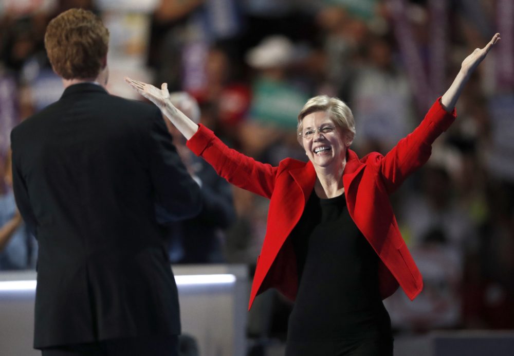 Sen. Elizabeth Warren greets Rep. Joe Kennedy after he introduced her to the crowd at the DNC in Philadelphia Monday night