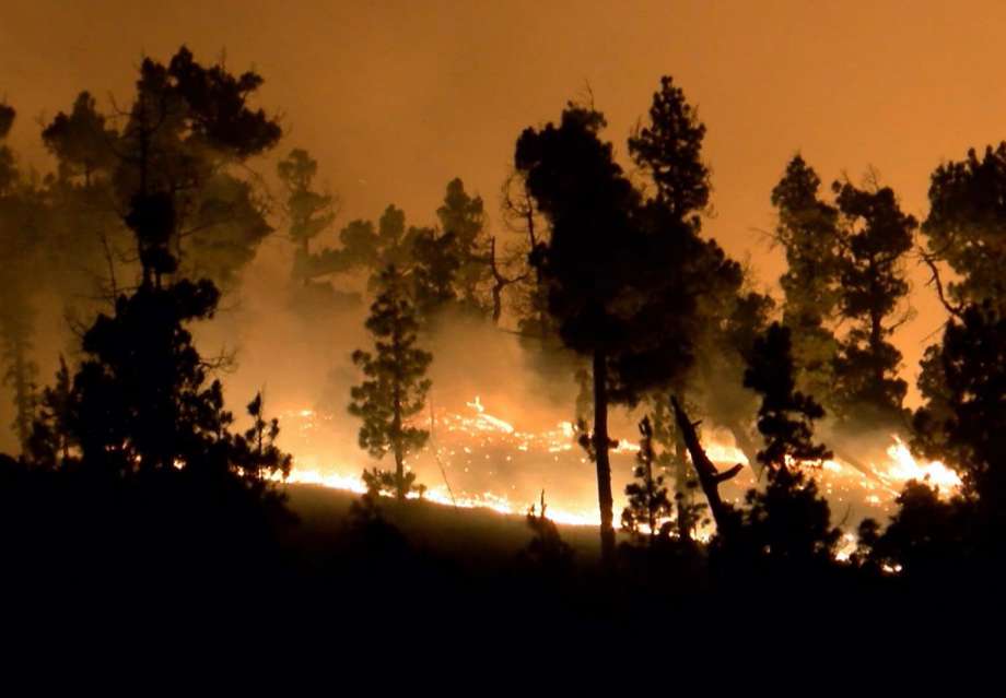 In this image made from video on Saturday Aug. 6 2016 a forest fire rages in La Palma on the Canary Islands Spain. Spanish authorities have evacuated 500 more residents in the path of a five-day-old forest fire on the Atlantic island of La Palma. The