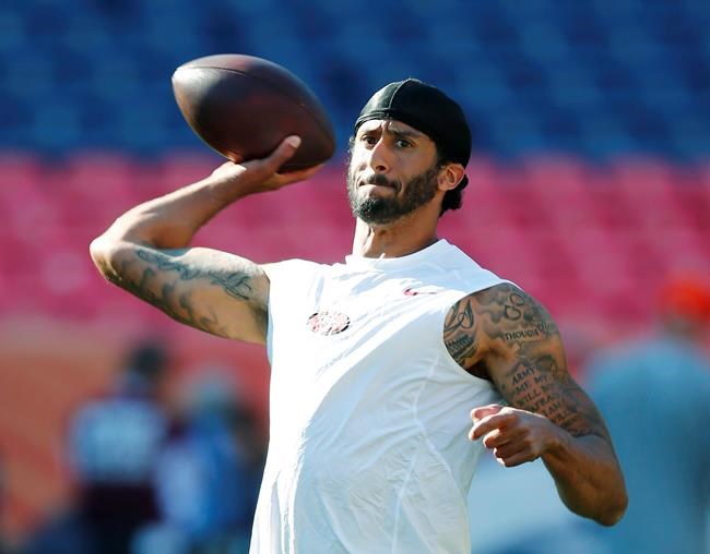 San Francisco 49ers quarterback Colin Kaepernick warms up before the team's preseason NFL football game against the Denver Broncos Saturday Aug. 20 2016 in Denver