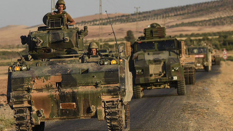 AFP  Getty Images              Turkish troops drive back to Turkey from the Syrian border town of Jarabulus on Friday