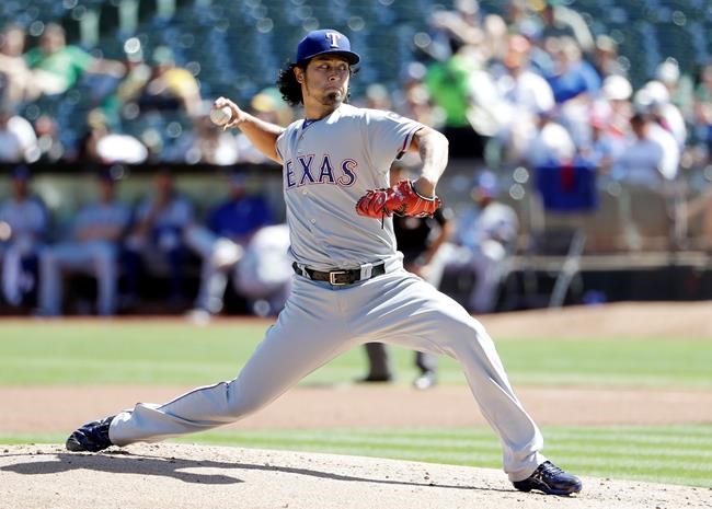 Texas Rangers starting pitcher Yu Darvish throws to the Oakland Athletics during the first inning of a baseball game Saturday Sept. 24 2016 in Oakland Calif