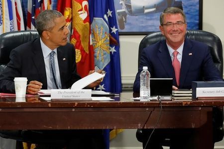 Obama and Carter sit down to a meeting of the National Security Council at the Pentagon in Arlington Virginia U.S