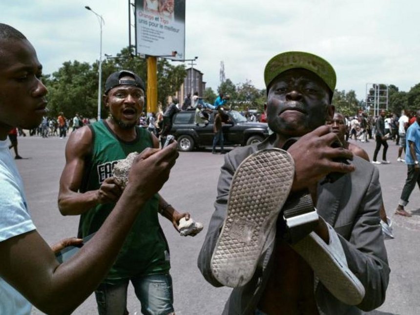 Congolese opposition activists gesture to the camera during a march to press President Joseph Kabila to step down in the Democratic Republic of Congo's capital Kinshasa September 19. /REUTERS