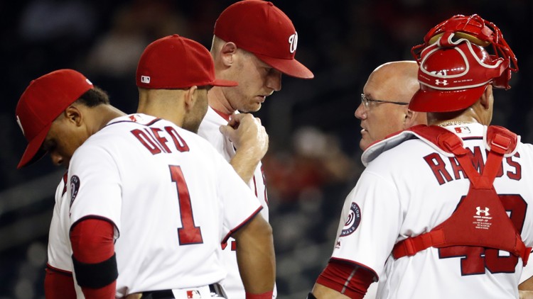 Strasburg feels pinch in elbow Nats beat Braves in 11th