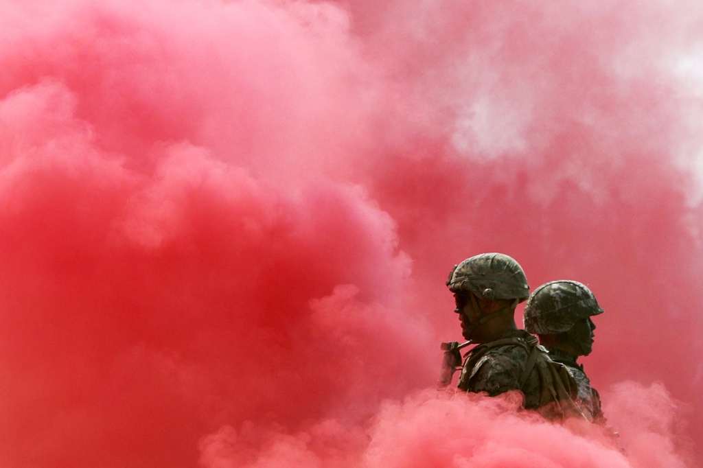 APTOPIX South Korea Koreas Tensions-8 South Korean and U.S. Marines stand in smoke Friday during the 66th Incheon Landing Operations Commemoration ceremony in Incheon South Korea