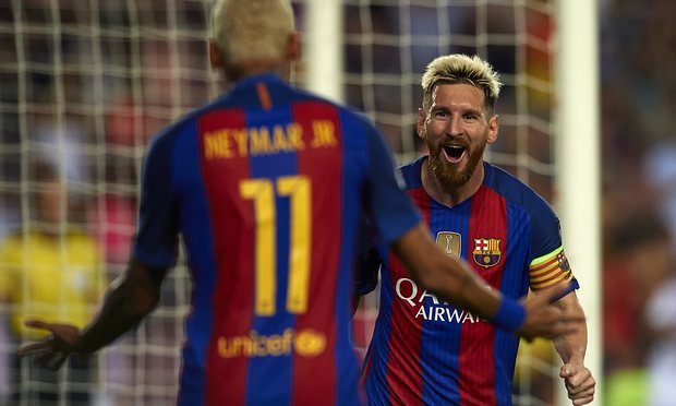 Lionel Messi of FC Barcelona celebrates scoring his team’s second goal with his teammate Neymar